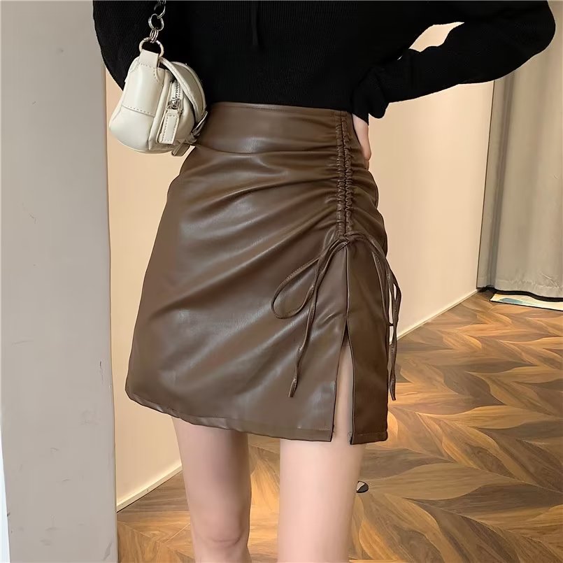 Large size black leather skirt skirt for women in spring and autumn fat MM design drawstring slit hip skirt high waist A-line short skirt