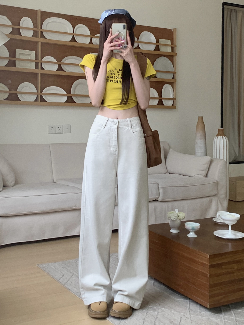 Actual shot of early spring loose wide-leg washed cotton straight floor-length denim trousers