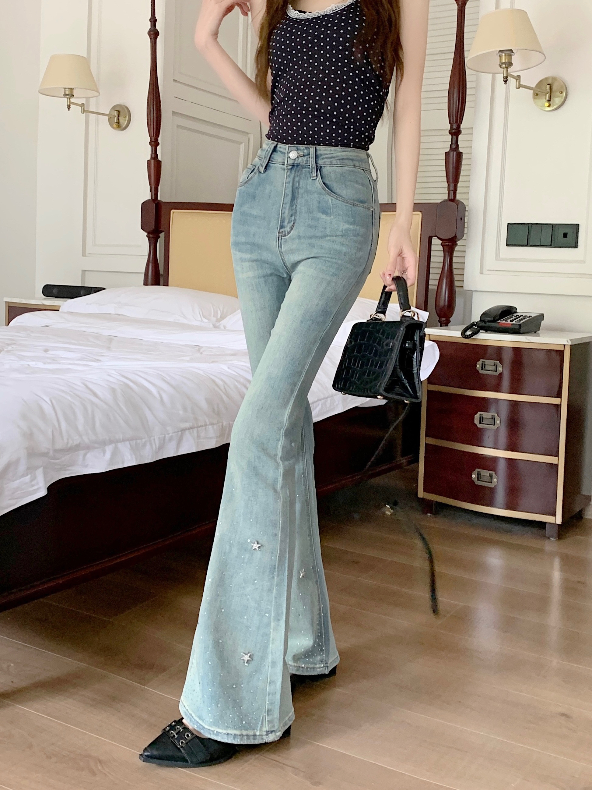 Actual shot of high-waisted and slimming star-studded jeans