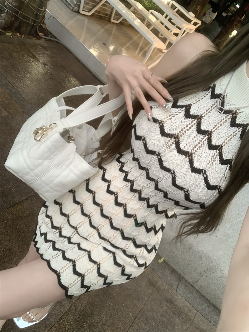 Actual shot of contrasting wavy pattern halter neck and elegant off-shoulder knitted skirt