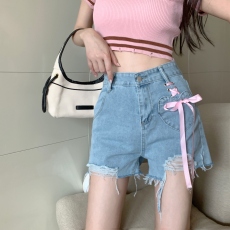 夏季新款设计感爱心口袋破洞蝴蝶结绑带牛仔短裤热裤女