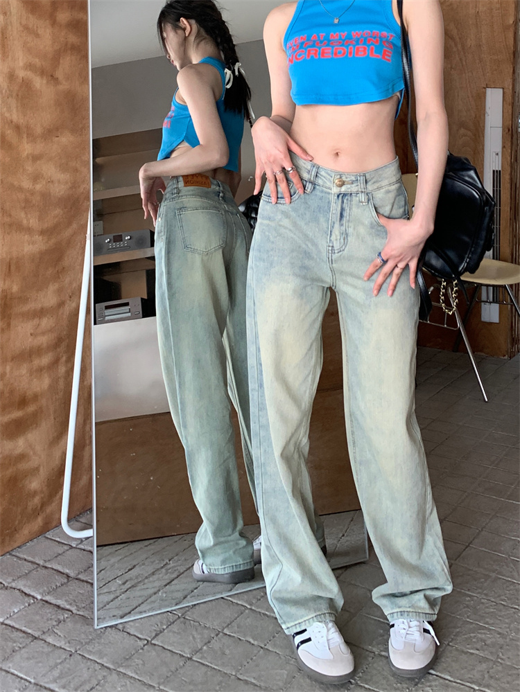 Actual shot of blue loose straight leg jeans, floor mopping pants for women