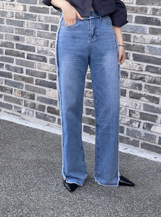 Raw slit paneled flared jeans