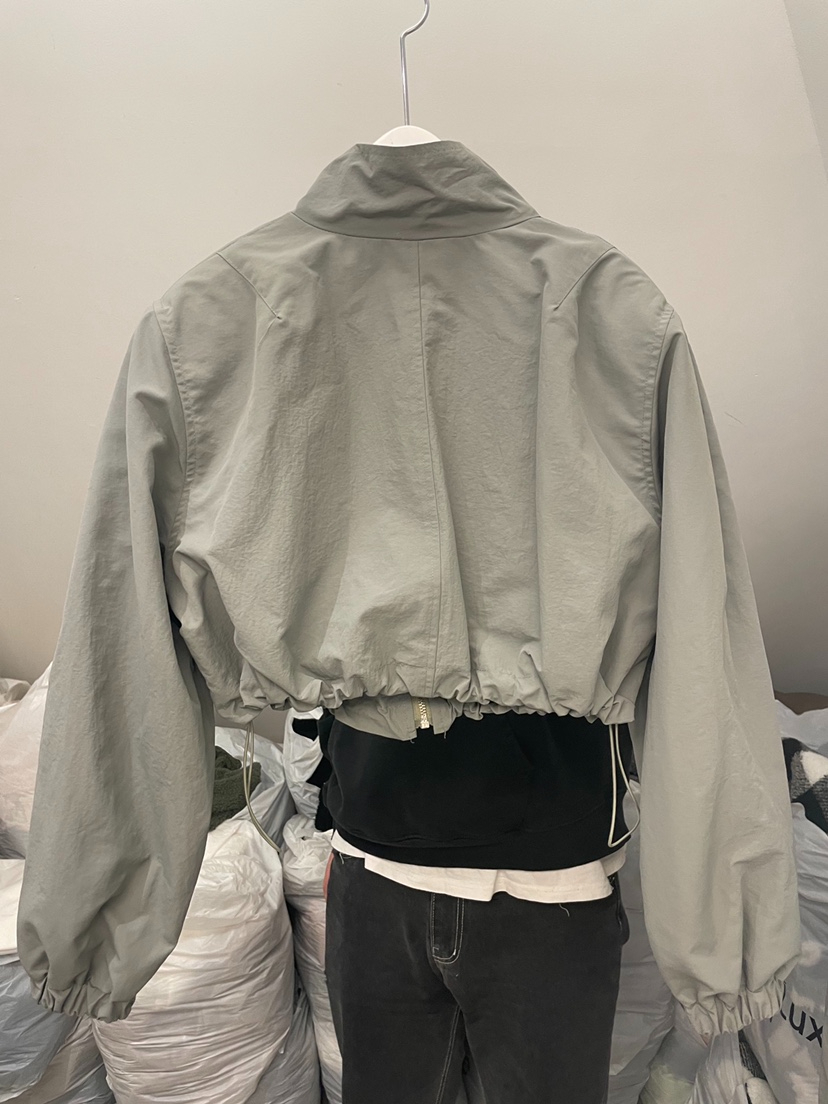 New style stand collar drawstring zipper puff long sleeve short jacket top for women