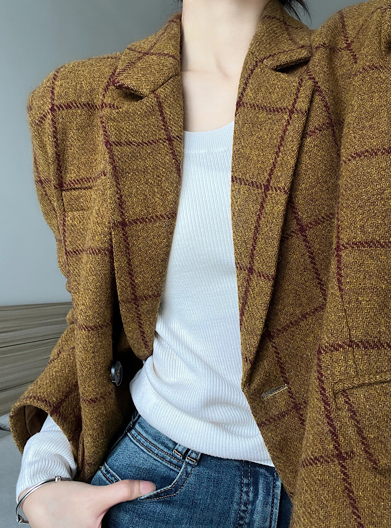 Real shot of retro woolen plaid suit jacket, classic British style simple suit