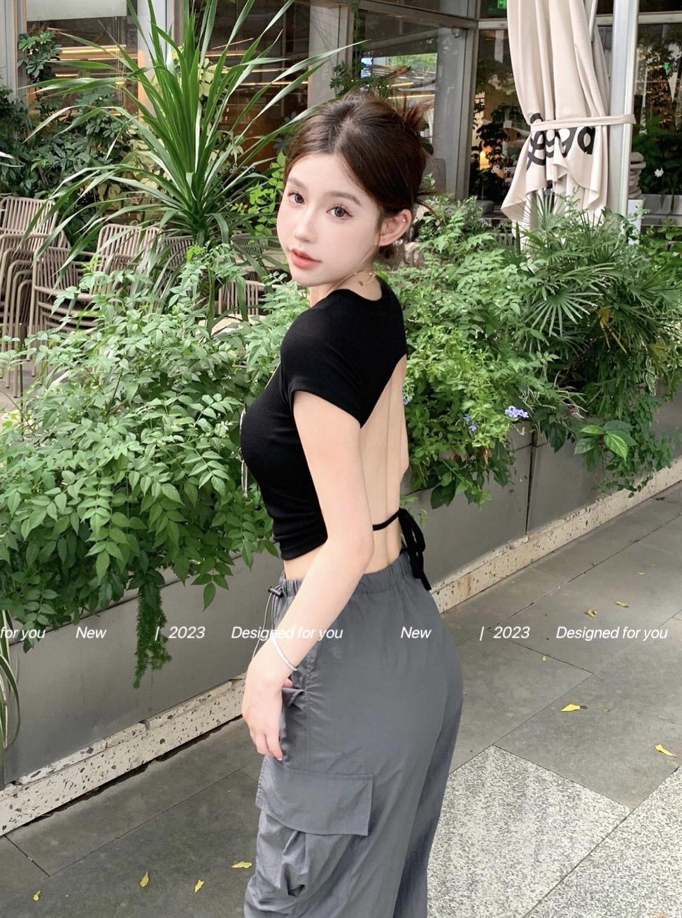 Real shot of a pure-desire hottie with her own breast pads, slim backless lace-up top with drawstring