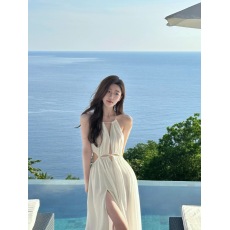 批发泰国三亚旅游拍照沙滩裙海边度假连衣裙纯欲性感镂空白色吊带长裙