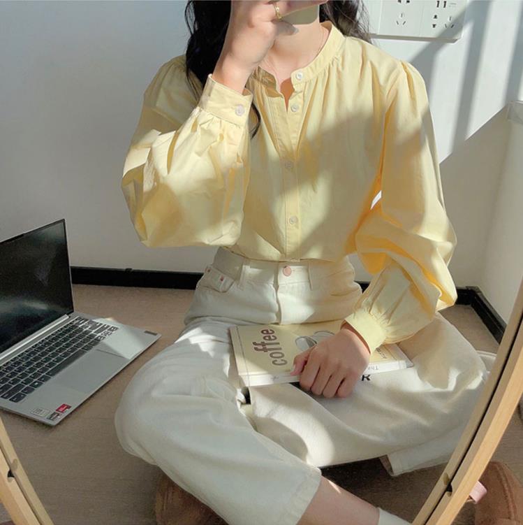 春秋奶黃色圓領長袖襯衣女早春季法式別致獨特設計感小眾襯衫上衣