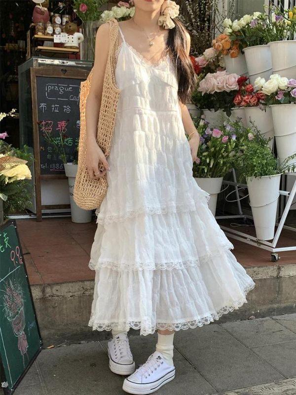 Lace suspender dress female summer seaside vacation sweet girl cake skirt first love pure milk sweet beach long skirt