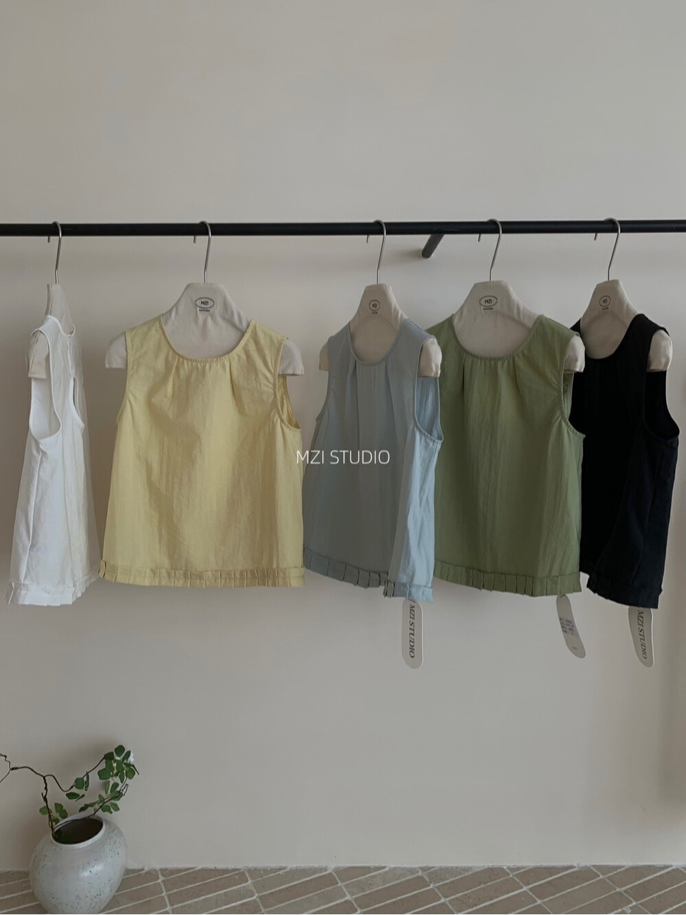 Japanese age-reducing back hollow design sleeveless French solid color hem pleated chic small women's vest