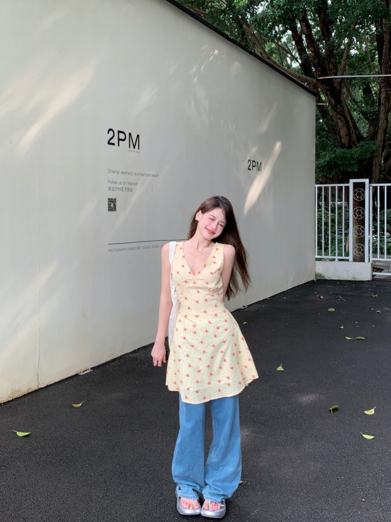 Actual shot of yellow large V-neck floral sleeveless strappy dress