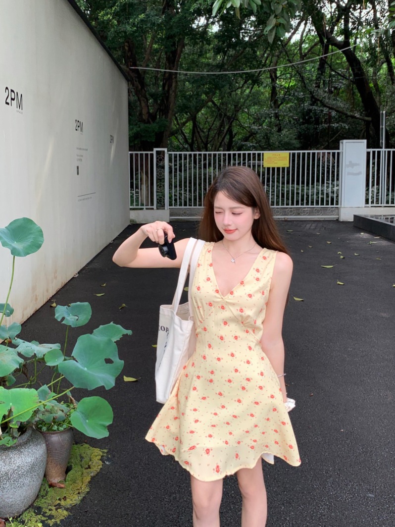 Actual shot of yellow large V-neck floral sleeveless strappy dress