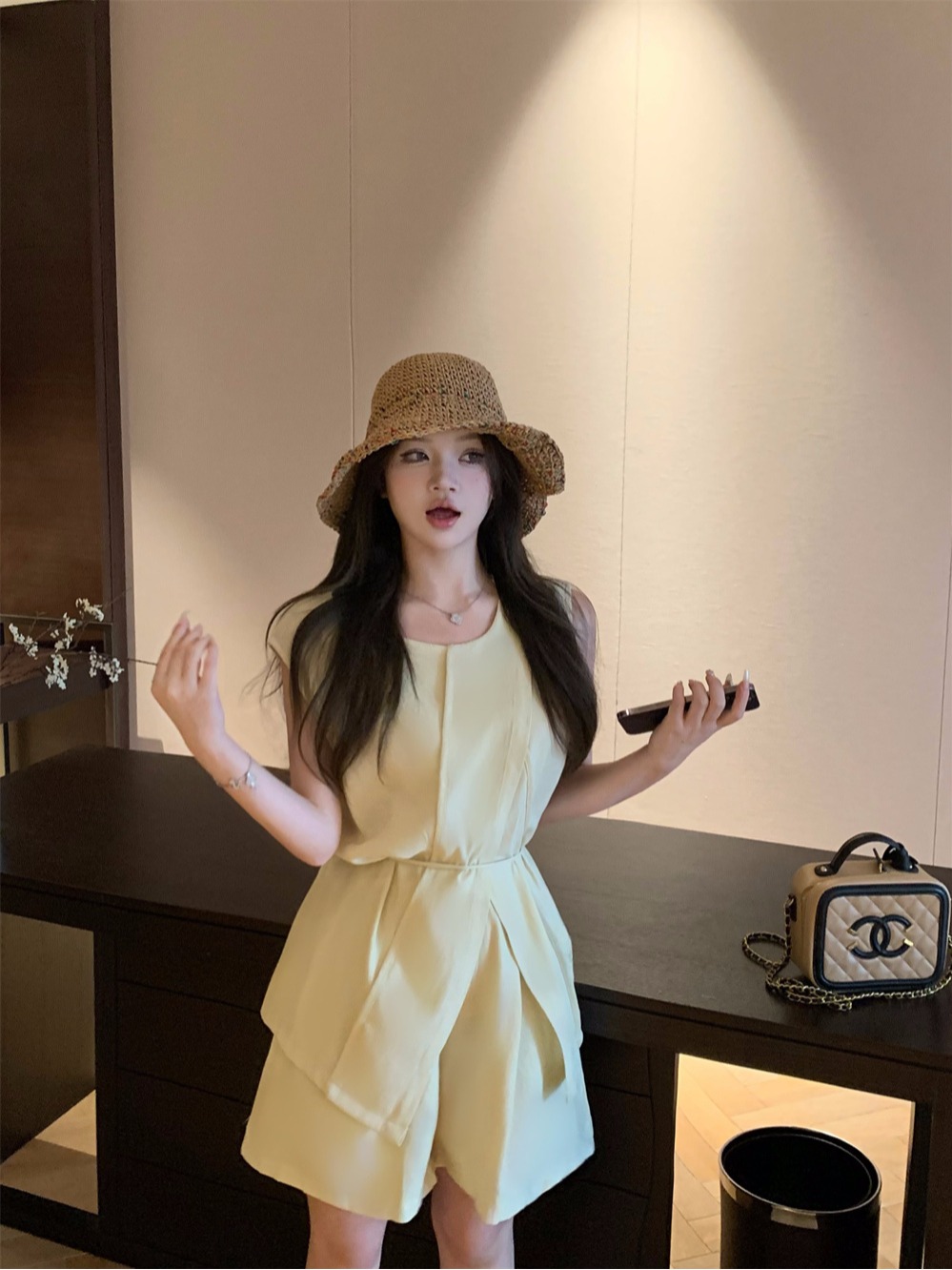 Real shot of fashion suit for women, summer design, slim casual sleeveless top, wide-leg shorts, two-piece set