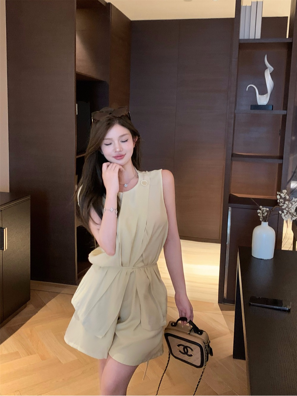 Real shot of fashion suit for women, summer design, slim casual sleeveless top, wide-leg shorts, two-piece set